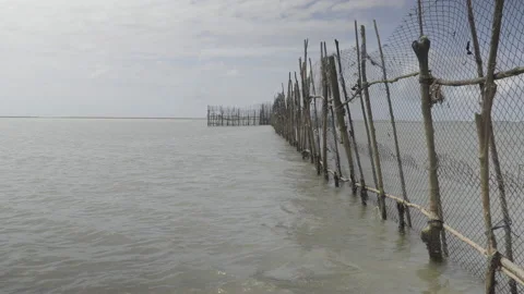 Rustic structure of fishing corrals shallow waters on the beach. Stock-Footage 232804980