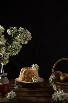 Rustic style apple bundt cake with sugar icing on old wooden table Stock Photos
