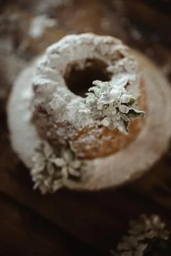 Rustic style apple bundt cake with powdered sugar on old wooden table Stock Photos