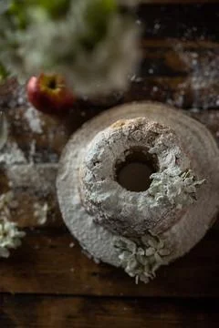 Rustic style apple bundt cake with powdered sugar on old wooden table Stock Photos
