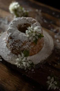 Rustic style apple bundt cake with powdered sugar on old wooden table Stock Photos