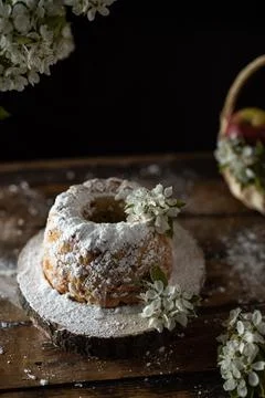 Rustic style apple bundt cake with powdered sugar on old wooden table Stock Photos