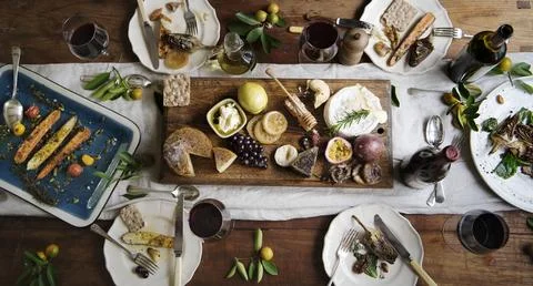 Rustic style dinner with cheese platter Stock Photos