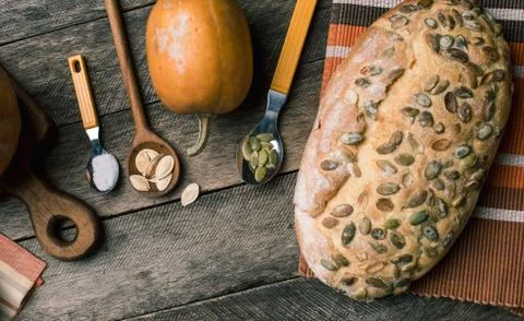 Rustic style pumpkins and bakery with seeds on cloth 스톡 사진