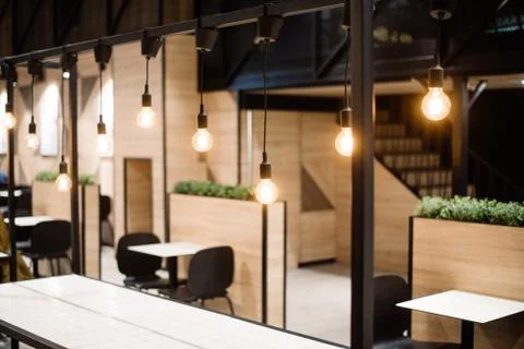 Rustic stylish interior of a cozy restaurant or cafe Stock Photos