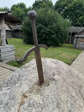 Rustic Sword Embedded in Stone Monument Stock Photos