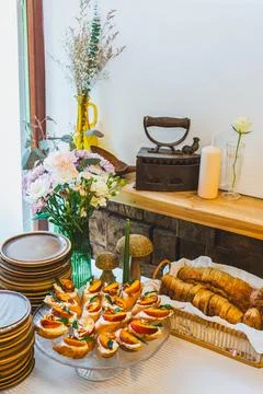 Rustic Table with Assorted Bread and Bruschetta Stock Photos