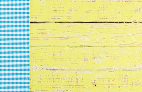 Rustic table background with blue fabric napkin.. Stock Photos