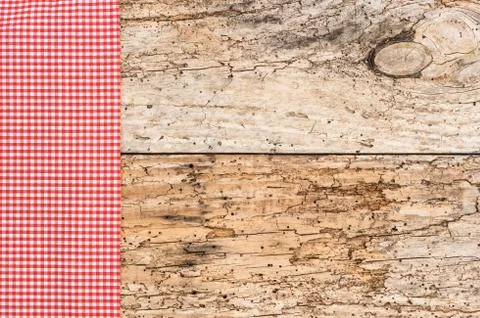 Rustic table background with red fabric napkin.. Stock Photos