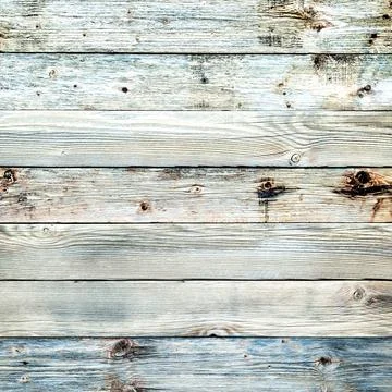 Rustic table built with planks of aged light wood. Abstract background. Stock Photos