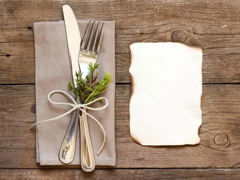 Rustic table setting and old burned paper Stock Photos