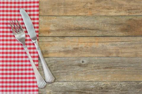 Rustic table setting with old silver cutlery and napkin decoration on wood Stock Photos