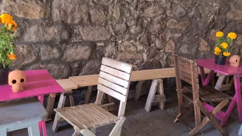 Rustic Tables with Marigolds and Clay Skull Stock Footage 286381093