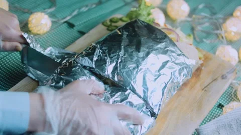 Rustic tabletop view: close view of a layered burrito filling Stock Footage 342168489