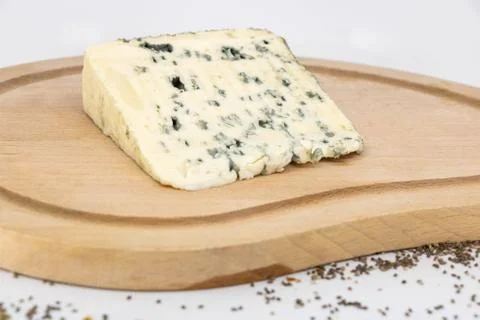 Rustic tasting of blue cheese with sheep's milk on a wooden plate Stock Photos