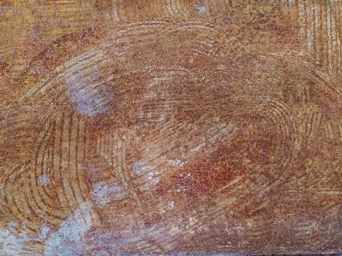 Rustic textured background with abstract circular patterns, evoking a warm we Stock Photos