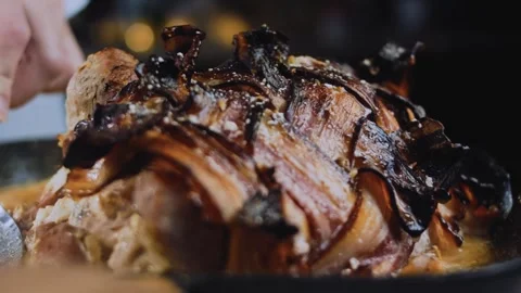 Rustic textured food: showing glossy bacon wrapped pork on a platter Stock Footage 342186582