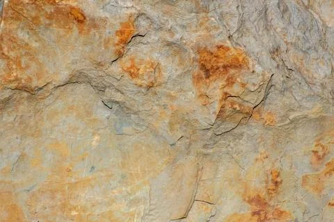 Rustic Textured Rock Surface Earth Tones Cracks Patterns Natural Background 스톡 사진