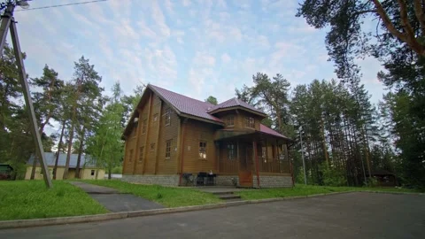 Rustic Timber House Nestled in Forested Countryside Stock Footage 257766319