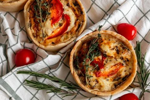 Rustic Tomato and Herb Tart with cherry tomatoes and rosemary, perfect for a veg Stock Photos