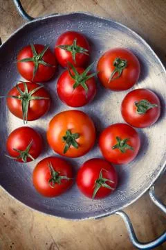 Rustic tomatoes. top view. vintage purple toning Stock Photos