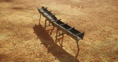 Rustic trough stands alone in arid landscape under bright sun Illustrazione stock