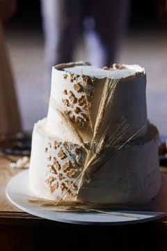 Rustic Two-Tier Wedding Cake with Wheat Accents, Gray Frosting, Natural Decor Stock Photos