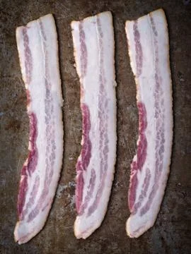 Rustic uncooked bacon Stock Photos