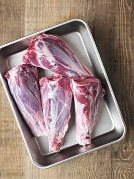Rustic uncooked lamb shank Stock Photos