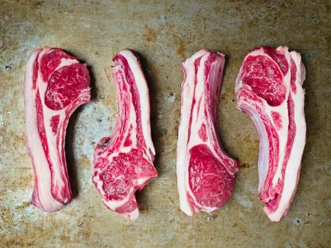 Rustic uncooked raw lamb chops Stock Photos