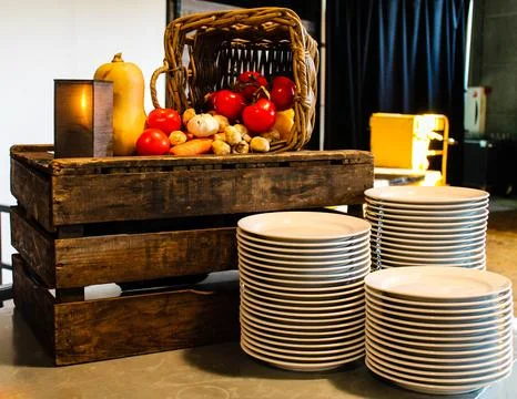 Rustic Vegetable Display with Plates Stock Photos