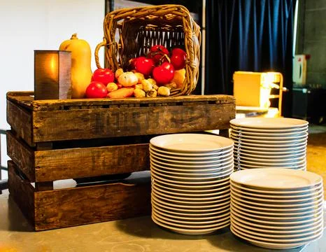 Rustic Vegetable Display with Plates Stock Photos