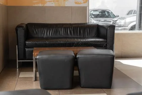 Rustic waiting office, with large brown furniture Stock Photos