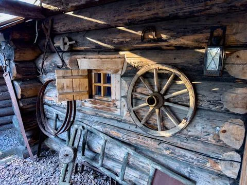 Rustic wall decor with vintage wagon wheel and wooden details Stock Photos