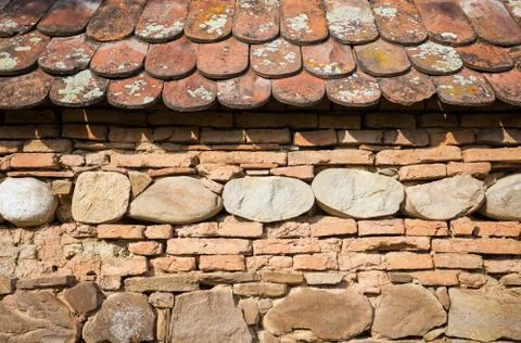 Rustic wall with layers of different comstruction materials Stock Photos