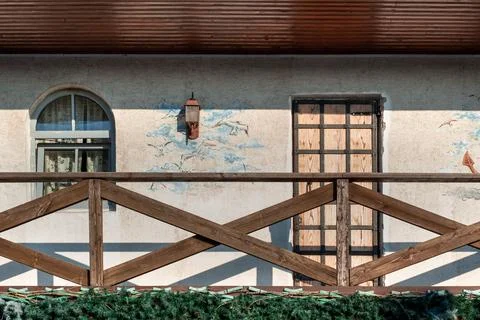 Rustic wall with a pattern. The old facade of a farmhouse with a window. 스톡 사진