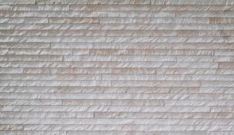 Rustic wall texture formed by small bricks Stock Photos