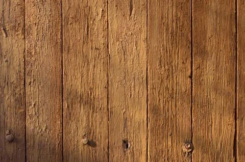 Rustic weathered barn wood background with knots and nail holes Stock Photos