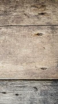 Rustic weathered barn wood background with knots and nail holes Stock Photos