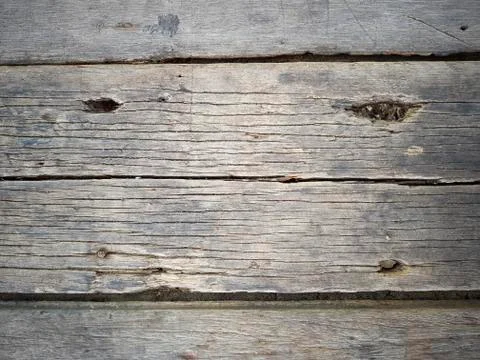 Rustic weathered barn wood background with knots and nail holes Stock Photos