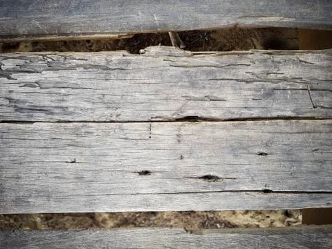 Rustic weathered barn wood background with knots and nail holes 写真素材