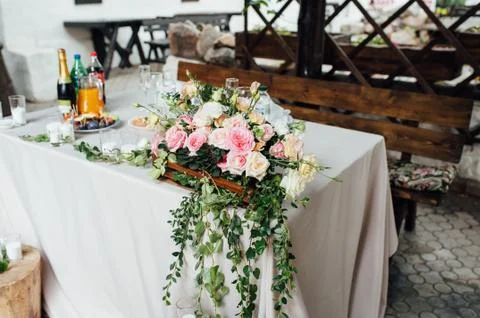 Rustic wedding decor on a timber background. Main table setting for bride and Stock Photos