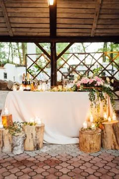 Rustic wedding decor on a timber background. Main table setting for bride and Stock Photos