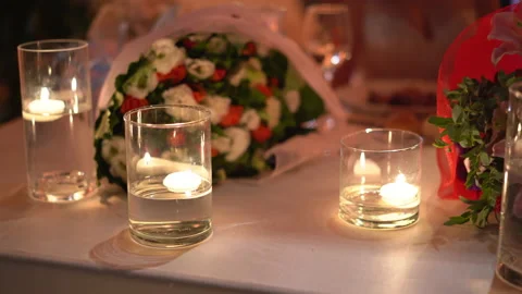 Rustic wedding table decoration, fresh flowers bouquets and crystal glasses with Stock Footage 225511562
