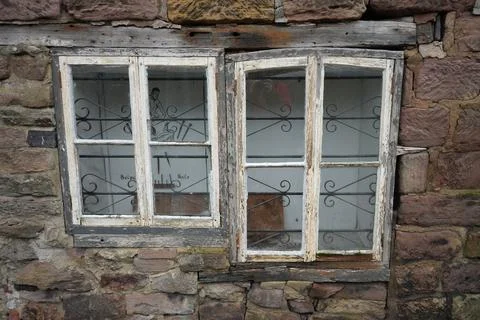 Rustic White Painted Windows With Peeling Paint In Old Stone Wall, Belper, Stock Photos