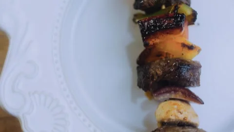 Rustic wholesome ingredient: close view of juicy steak cubes on a skewer Stock Footage 342182791