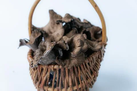 Rustic wicker basket filled with dark. Fotos Stock