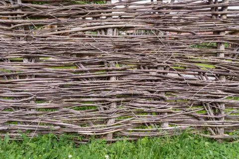 Rustic wicker fence, shot straight close up Stock Photos