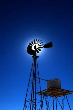 Rustic windmill with a blue sky Stock Photos