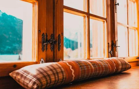 Rustic window and snowy mountains in background Stock Photos